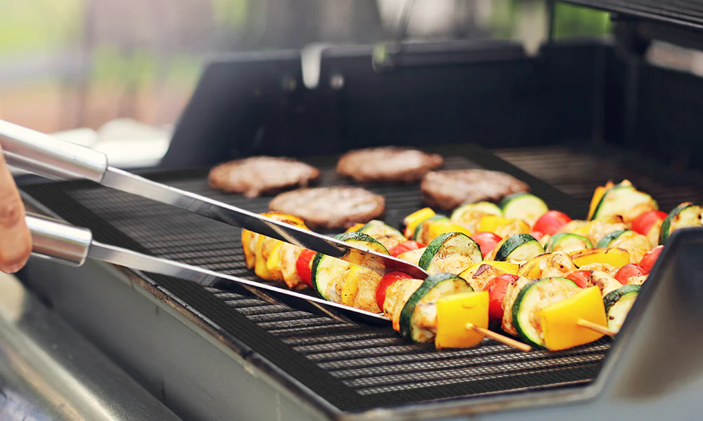 Barbecuing is an art form, a tradition that brings friends and family together to enjoy deliciously grilled food. However, the joy of grilling often comes with challenges, such as food sticking to the grill, uneven cooking, and the dreaded cleanup process. That's where our BBQ grill mats come in, offering a revolutionary solution to these grilling woes. Our grill mats are designed to maximize flavor and minimize mess, ensuring that every grilling experience is both enjoyable and hassle-free.
Why Use a BBQ Grill Mat?
The primary advantage of using a BBQ grill mat is its non-stick surface. Traditional grilling directly on the grate can cause food to stick, leading to tearing and loss of those precious juices. Our grill mats provide a smooth, non-stick surface, allowing you to cook everything from delicate fish to juicy steaks without sticking or falling through the grate.
Another key benefit is the even heat distribution. Grill mats help to distribute heat more evenly across the cooking surface, reducing hot spots and preventing flare-ups. This results in more consistent cooking and perfectly grilled food every time.
Healthier Grilling with Less Fat
Our BBQ grill mats not only make grilling easier but also healthier. Since the mats provide a non-stick surface, you can reduce the amount of oil or butter needed for cooking, leading to healthier meals. Moreover, the mats prevent flare-ups caused by dripping fat, which can create carcinogenic compounds. By using our grill mats, you can enjoy healthier grilled dishes with all the flavors and none of the guilt.
Protecting Your Grill and Enhancing Flavor
In addition to health benefits, our BBQ grill mats protect your grill from wear and tear. They prevent small food pieces and marinades from falling through the grate, which can cause buildup and corrosion over time. This not only extends the life of your grill but also keeps it cleaner.
The mats also enhance the flavor of your food. They retain marinades and sauces, allowing them to caramelize on the food rather than dripping away. This results in tastier, more flavorful dishes that are sure to impress your guests.
Versatility in Cooking
Our BBQ grill mats are incredibly versatile and can be used to cook a wide range of foods. They are perfect for grilling vegetables, eggs, pancakes, bacon, and even pizza. The mats open up a whole new world of grilling possibilities, allowing you to experiment with foods that would otherwise be difficult or impossible to grill.
Easy to Clean and Reusable
One of the most significant advantages of our grill mats is their ease of cleaning. Unlike traditional grates, which require vigorous scrubbing, our mats can be easily wiped clean with soap and water. They are also dishwasher safe, making the cleanup process a breeze. The mats are durable and reusable, ensuring that you get plenty of use out of each one.
Safe and High-Quality Materials
Safety is a top priority, and our BBQ grill mats are made from high-quality, heat-resistant materials that are free from harmful chemicals like PFOA and BPA. They can withstand high temperatures without melting or causing any harmful fumes, ensuring a safe grilling experience.
How to Use and Maintain Your BBQ Grill Mat
Using our grill mats is straightforward. Simply place the mat on your grill and preheat it as usual. You can then cook your food on the mat, using your usual grilling techniques. After use, let the mat cool down before washing it with soap and water or placing it in the dishwasher.
To maintain the quality of your grill mat, avoid using metal utensils, as they can damage the non-stick surface. Instead, opt for silicone or wooden utensils. Additionally, while our mats are heat-resistant, it's best to avoid direct exposure to flames or extremely high temperatures.
Our BBQ grill mats are a game-changer for any grilling enthusiast. They offer a multitude of benefits, from healthier cooking and enhanced flavors to easy cleanup and protection for your grill. Whether you're a seasoned grill master or a beginner, our grill mats will make your grilling experience more enjoyable and hassle-free. Say goodbye to sticking, flare-ups, and tedious cleaning, and say hello to perfectly grilled food every time with our BBQ grill mats.
Maximize Flavor and Minimize Mess with Our BBQ Grill Mats